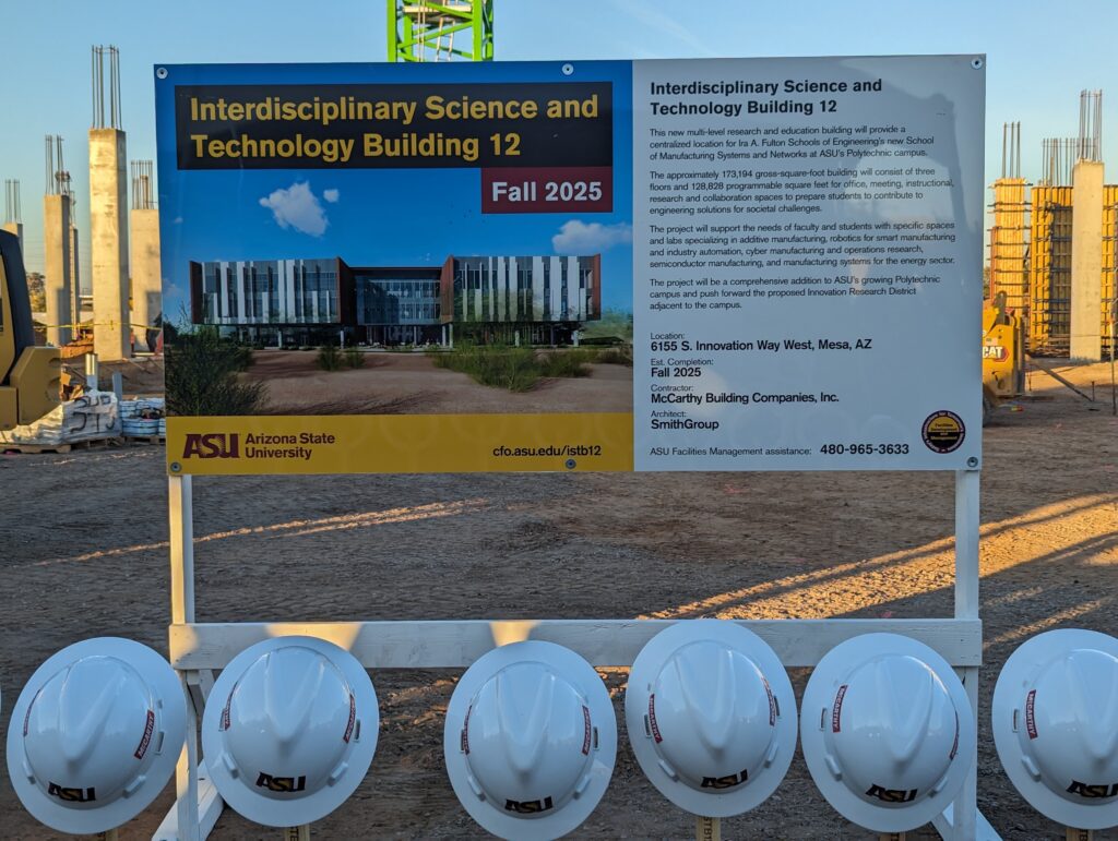 A sign explaining ASU's Polytechnic Campus' expansion project, creating a new manufacturing building.